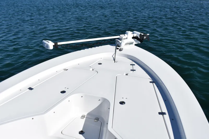 Slide: The Image of 2015 Sportsman Masters 227 Bay Boat on calm water, featuring a sleek bow design. - 6