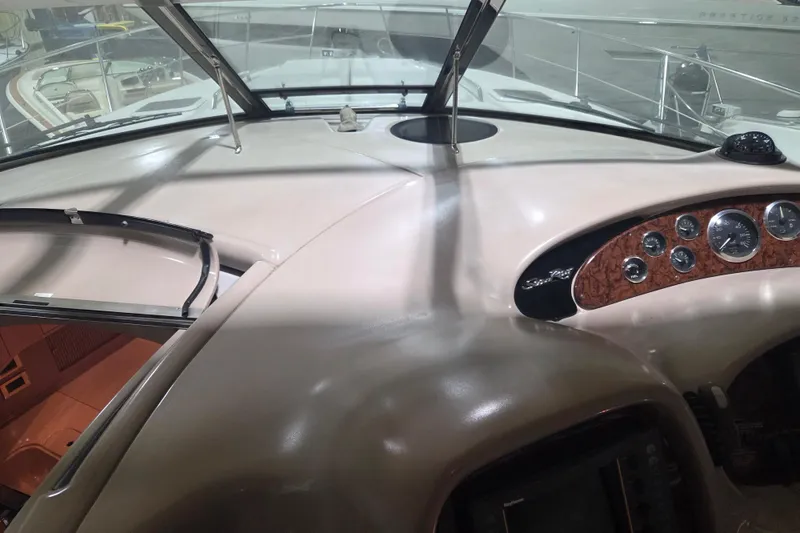 Slide: The Image of Dashboard of a 2000 Sea Ray 410 Sundancer yacht with gauges and controls. - 15