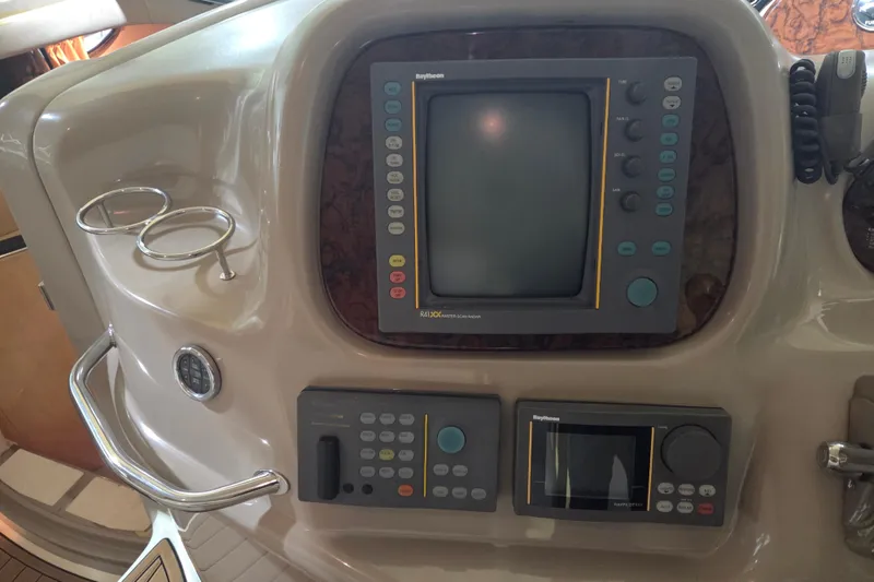Slide: The Image of Control panel of a 2000 Sea Ray 410 Sundancer boat with navigation equipment. - 16