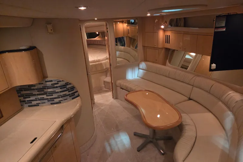 Slide: The Image of Luxurious interior of 2000 Sea Ray 410 Sundancer yacht with elegant seating and modern design. - 22