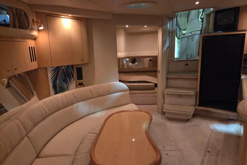 Slide: The Image of Interior of 2000 Sea Ray 410 Sundancer yacht with elegant seating and cabinetry. - 23