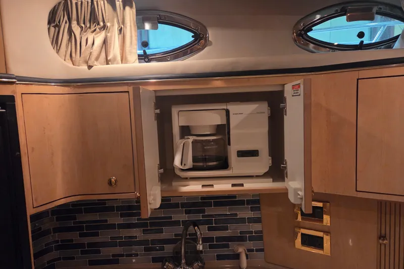 Slide: The Image of Coffee maker in a 2000 Sea Ray 410 Sundancer yacht kitchen cabinet. - 27