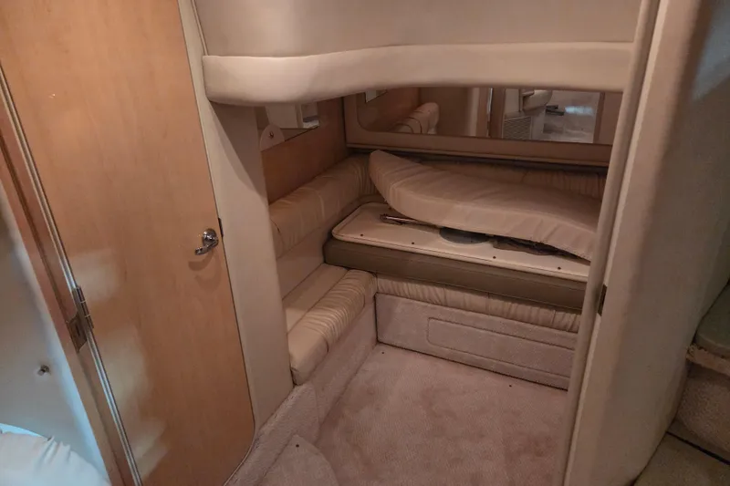 Slide: The Image of Interior cabin of 2000 Sea Ray 410 Sundancer yacht, featuring cozy seating and elegant design. - 29