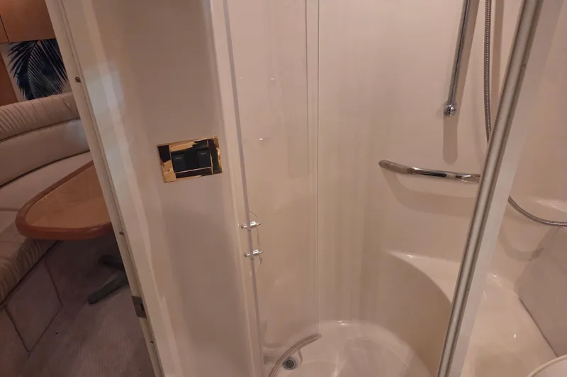 Slide: The Image of Shower area in 2000 Sea Ray 410 Sundancer yacht with adjacent seating. - 43
