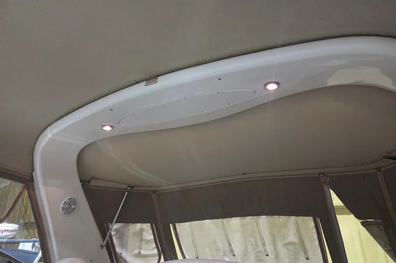 Slide: The Image of Interior view of 2000 Sea Ray 410 Sundancer boat with ceiling lights. - 54