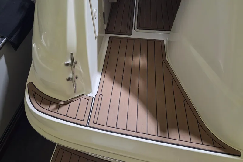 Slide: The Image of Teak deck of 2000 Sea Ray 410 Sundancer boat, showcasing elegant design. - 67