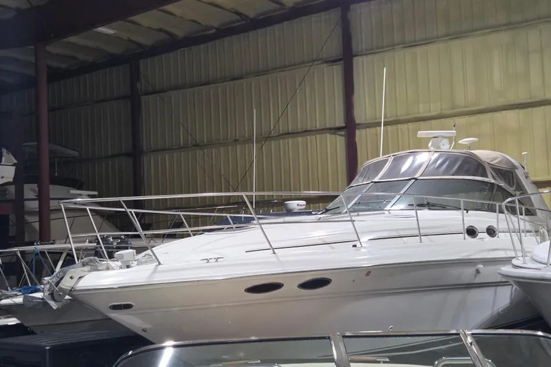 Slide: The Image of 2000 Sea Ray 410 Sundancer yacht in indoor storage facility. - 70