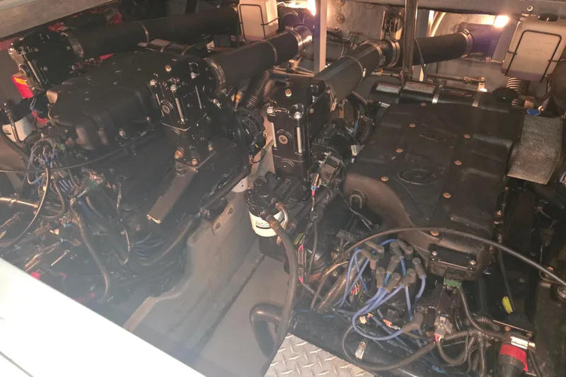 Slide: The Image of Engine room of 2000 Sea Ray 410 Sundancer with visible mechanical components. - 71