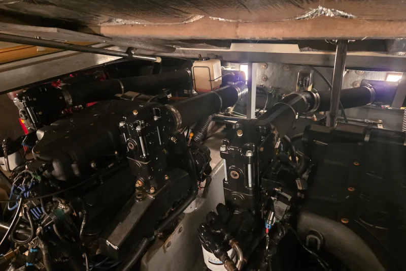 Slide: The Image of Engine room of a 2000 Sea Ray 410 Sundancer boat, showcasing mechanical components. - 74