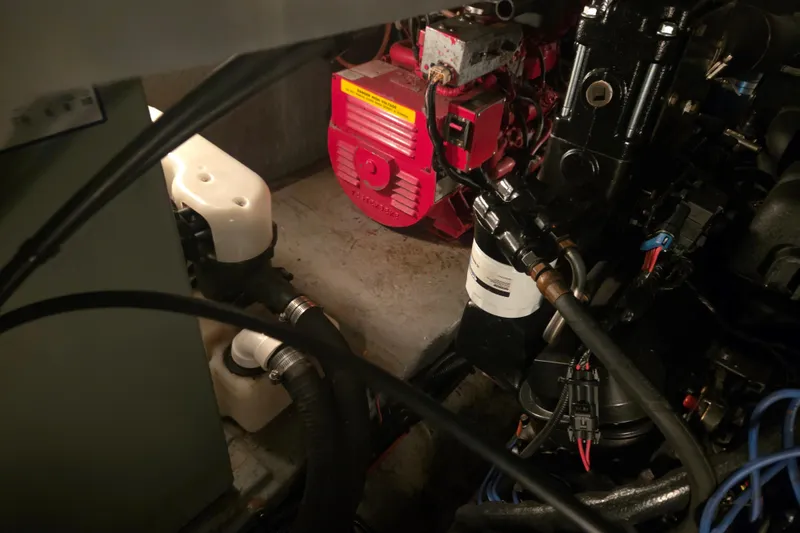 Slide: The Image of Engine room of 2000 Sea Ray 410 Sundancer with visible machinery and components. - 76