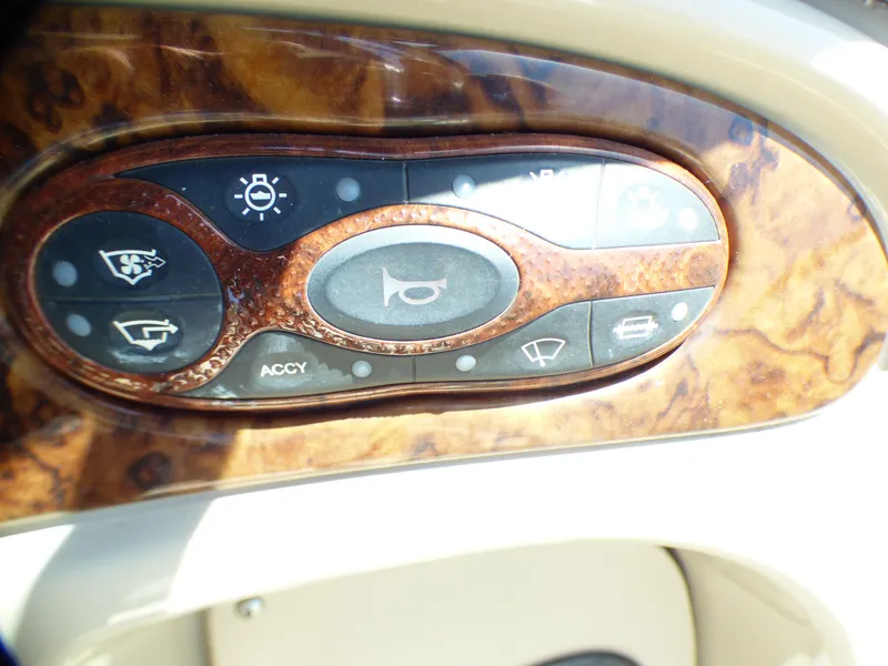Slide: The Image of Control panel of 2003 Sea Ray 260 Sundancer boat with wood finish. - 18