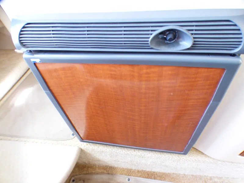 Slide: The Image of Wood-paneled refrigerator in 2003 Sea Ray 260 Sundancer boat interior. - 22