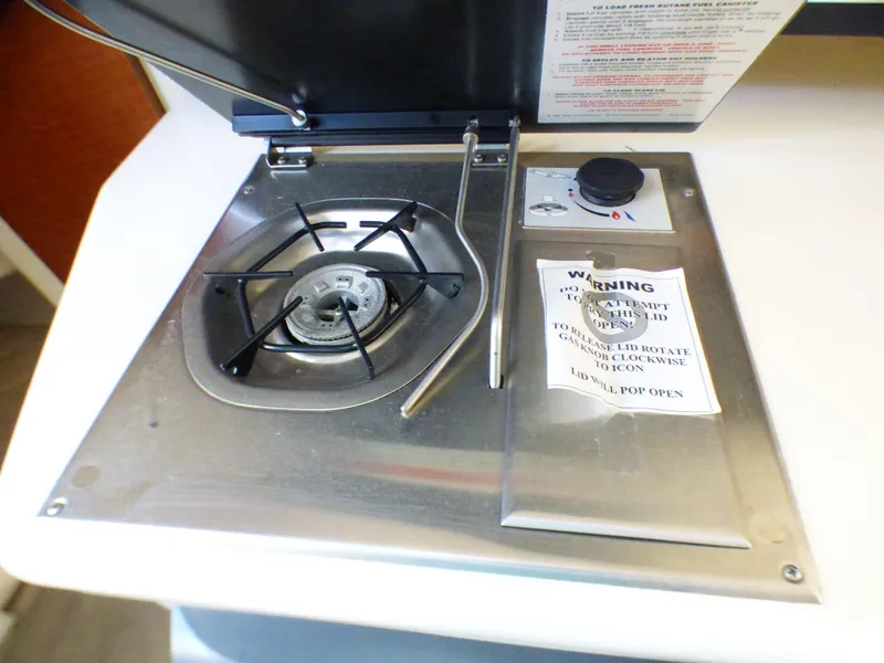 Slide: The Image of 2003 Sea Ray 260 Sundancer stove with single burner and control knob. - 23