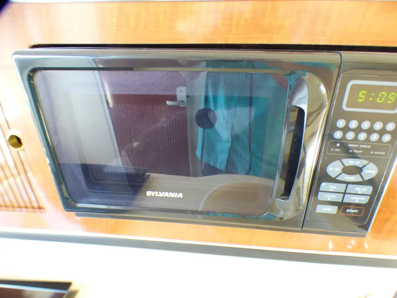 Slide: The Image of Sylvania microwave in 2003 Sea Ray 260 Sundancer boat interior. - 24