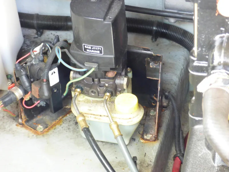 Slide: The Image of Engine compartment of 2003 Sea Ray 260 Sundancer with hydraulic components and wiring. - 36