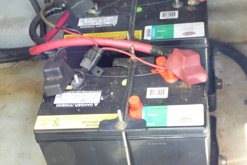 Slide: The Image of Batteries in a 2003 Sea Ray 260 Sundancer boat, showing wiring and connections. - 38