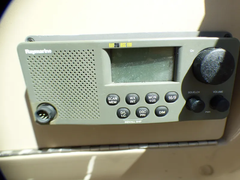 Slide: The Image of Raymarine marine radio on 2003 Sea Ray 260 Sundancer boat dashboard. - 39
