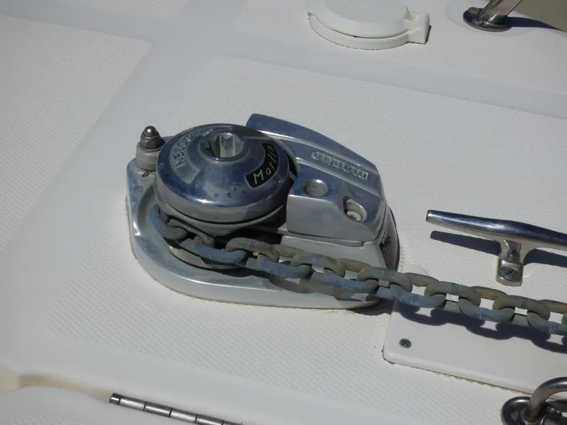 Slide: The Image of Anchor windlass on 2003 Sea Ray 260 Sundancer boat deck. - 42