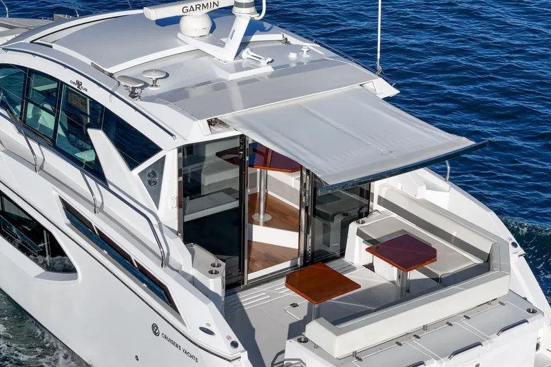 Slide: The Image of 2023 Cruisers Yachts 42 Cantius with spacious deck and modern design on the water. - 11