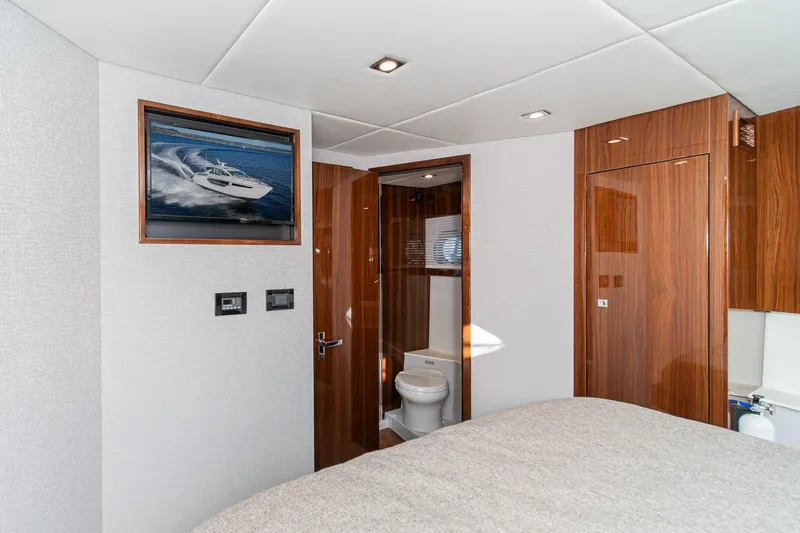 Slide: The Image of Luxurious interior of 2023 Cruisers Yachts 42 Cantius with modern bathroom and elegant wood finishes. - 29