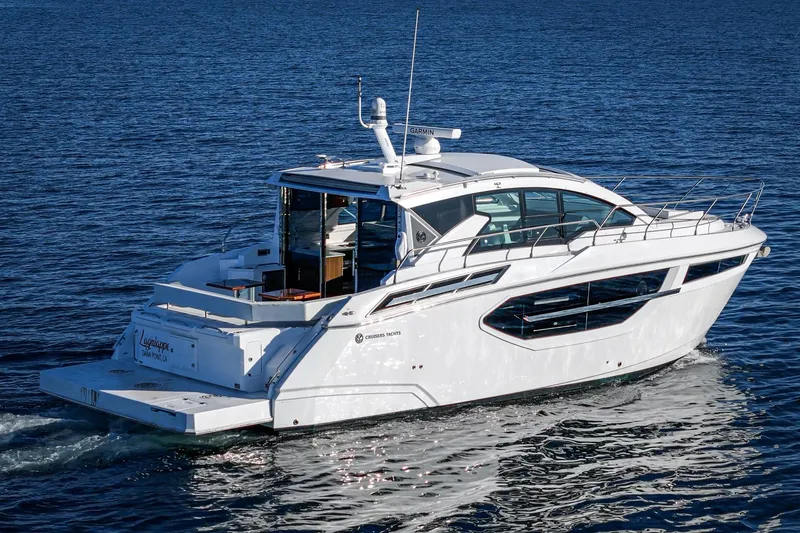 Slide: The Image of 2023 Cruisers Yachts 42 Cantius sailing on open water, showcasing sleek design. - 3