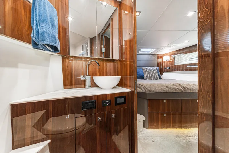 Slide: The Image of Luxurious 2023 Cruisers Yachts 42 Cantius interior with elegant wood finish and modern amenities. - 30