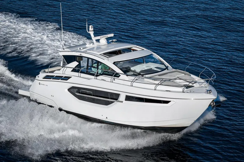 Slide: The Image of 2023 Cruisers Yachts 42 Cantius cruising on open water, showcasing sleek design and luxury. - 6