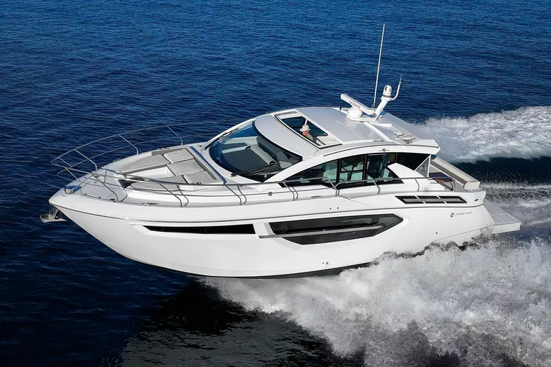 Slide: The Image of 2023 Cruisers Yachts 42 Cantius cruising on open water, showcasing sleek design and performance. - 7