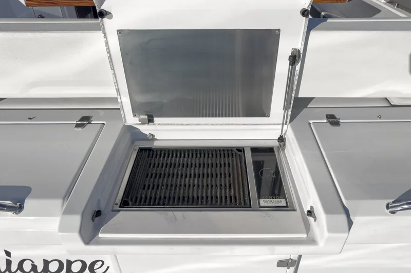 Slide: The Image of Outdoor grill on 2023 Cruisers Yachts 42 Cantius, featuring sleek design and functionality. - 10