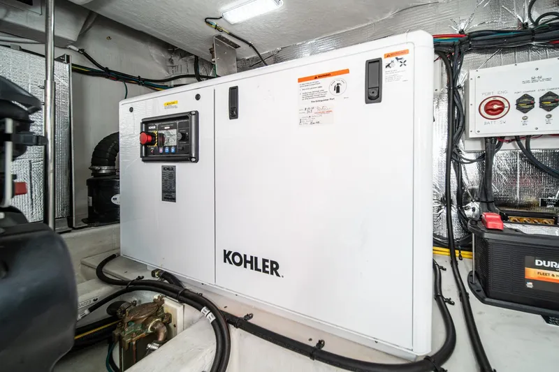 Slide: The Image of Engine room of 2023 Cruisers Yachts 42 Cantius with Kohler generator. - 42