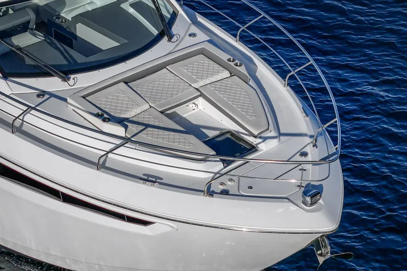 Slide: The Image of 2023 Cruisers Yachts 42 Cantius bow view, featuring sleek design and luxurious deck seating. - 5