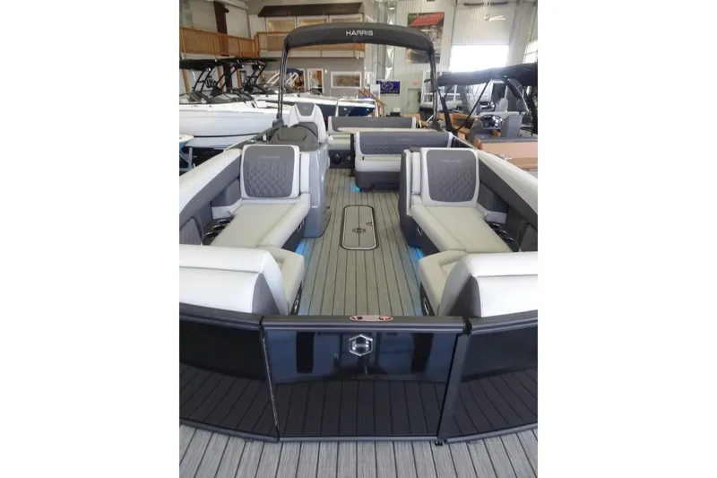 Slide: The Image of 2026 Harris Sunliner 250 pontoon boat interior with luxurious seating and modern design. - 11