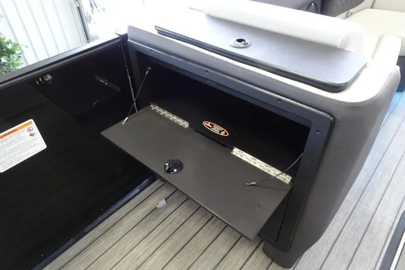 Slide: The Image of Storage compartment in 2026 Harris Sunliner 250 boat, featuring sleek design and practical functionality. - 19