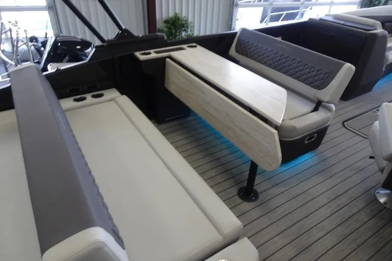 Slide: The Image of 2026 Harris Sunliner 250 interior with modern seating and foldable table design. - 28