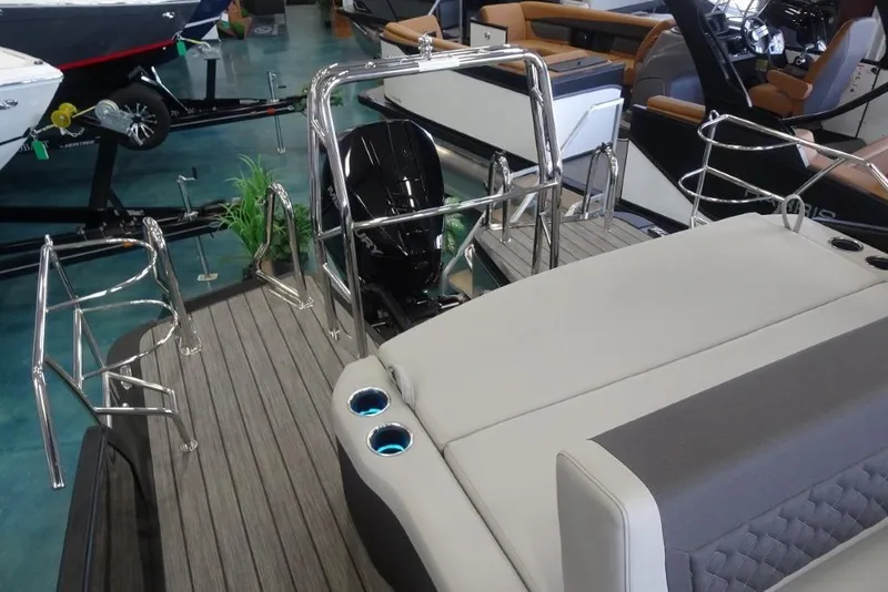 Slide: The Image of 2026 Harris Sunliner 250 boat interior with sleek seating and modern design elements. - 30