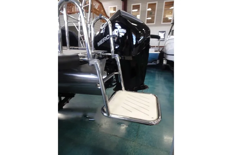 Slide: The Image of 2026 Harris Sunliner 250 boat with Mercury engine and swim platform. - 8