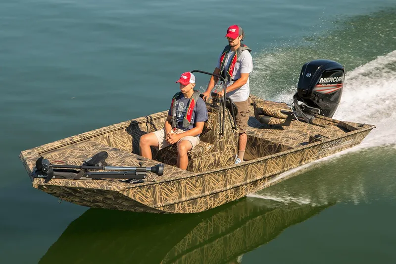 Slide: The Image of Manufacturer Provided Image: 2018 Lowe Roughneck 1760CC boat on water with two people, camo design, Mercury outboard motor. - 11