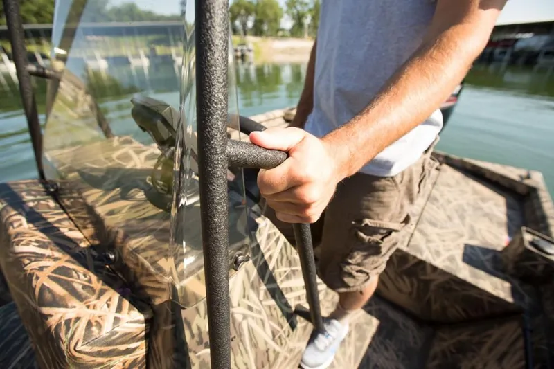 Slide: The Image of Manufacturer Provided Image: Man holding railing on 2018 Lowe Roughneck 1760CC boat. - 17