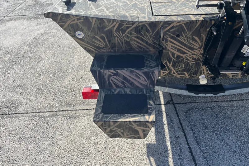Slide: The Image of 2018 Lowe Roughneck 1760CC boat with camouflage pattern and rear step detail. - 6