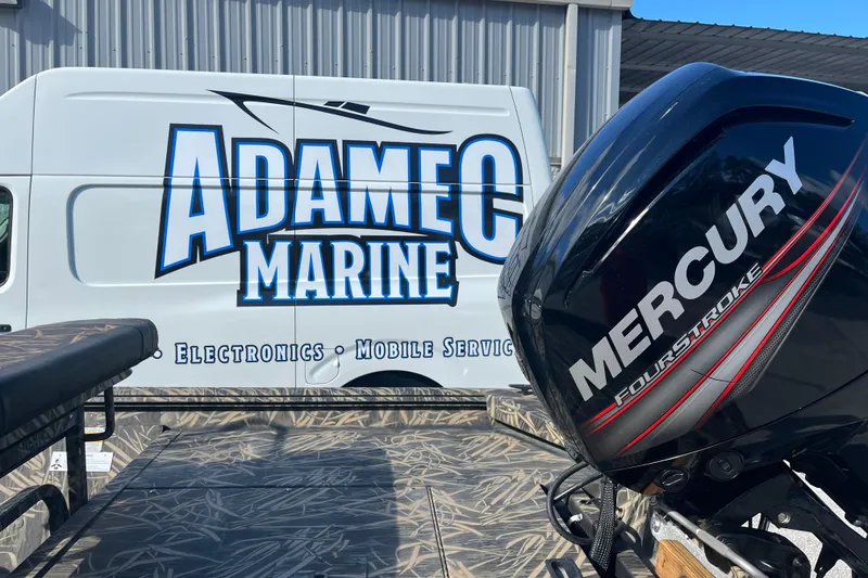 Slide: The Image of 2018 Lowe Roughneck 1760CC with Mercury FourStroke engine near Adamec Marine service van. - 9