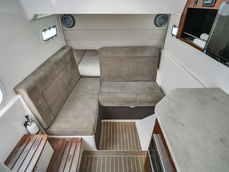 Slide: The Image of Interior of 2015 Everglades 435 Center Console with seating area. - 15