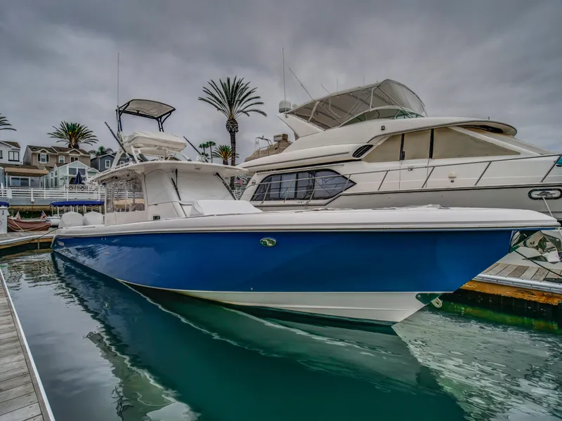 Slide: The Image of 2015 Everglades 435 Center Console boat docked in harbor. - 3