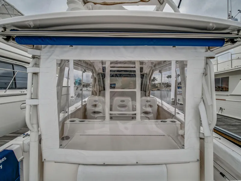 Slide: The Image of 2015 Everglades 435 Center Console boat, rear view at dock. - 7