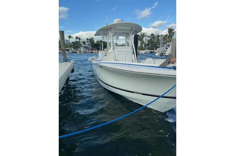 Slide: The Image of 2017 Regulator 25 boat docked on a sunny day with clear skies. - 2