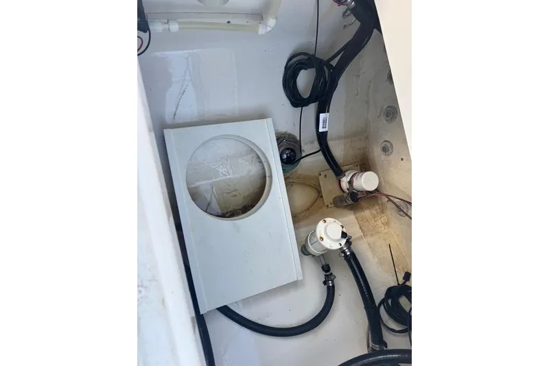 Slide: The Image of 2017 Regulator 25 boat interior showing wiring and components. - 26
