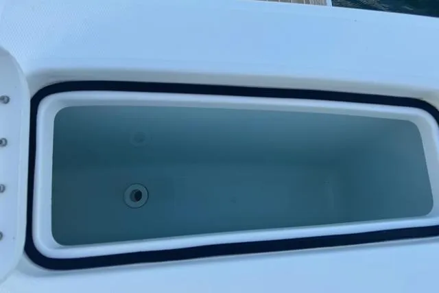 Slide: The Image of Livewell on 2017 Regulator 25 boat, open and empty. - 28