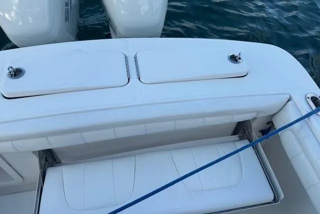 Slide: The Image of 2017 Regulator 25 boat with white seating and engines. - 29