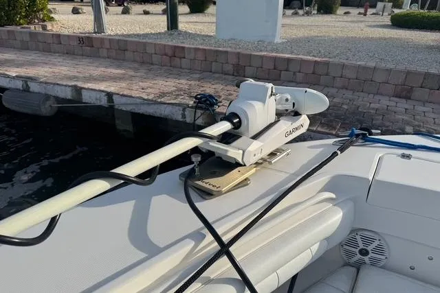 Slide: The Image of 2017 Regulator 25 boat with Garmin equipment docked at a marina. - 34