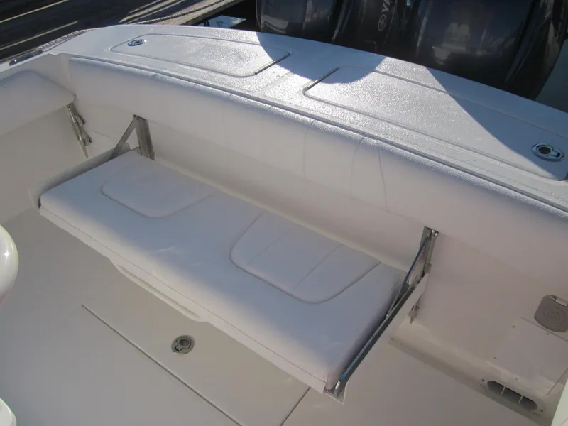 Slide: The Image of 2014 Regulator 25 boat with foldable rear bench seat. - 12
