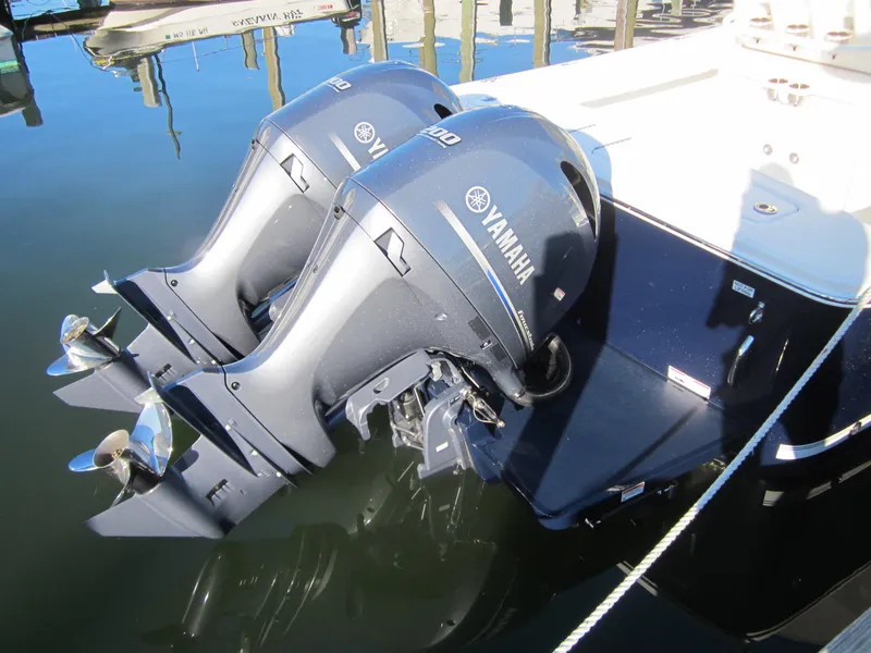 Slide: The Image of 2014 Regulator 25 with Yamaha outboard motors in water. - 18